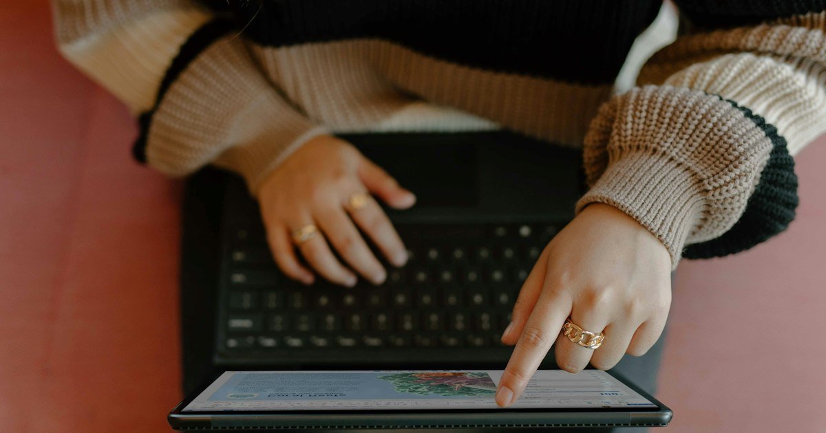 Person using a tablet and keyboard to complete a short questionnaire