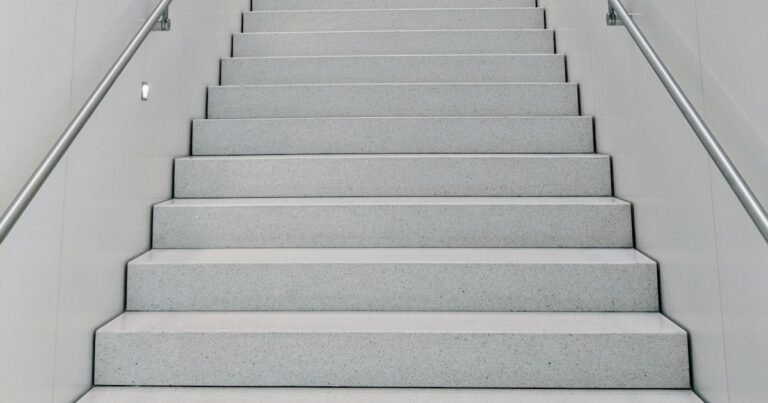 Bright white staircase leading upward, one step at a time